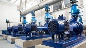 Row of blue industrial pumps